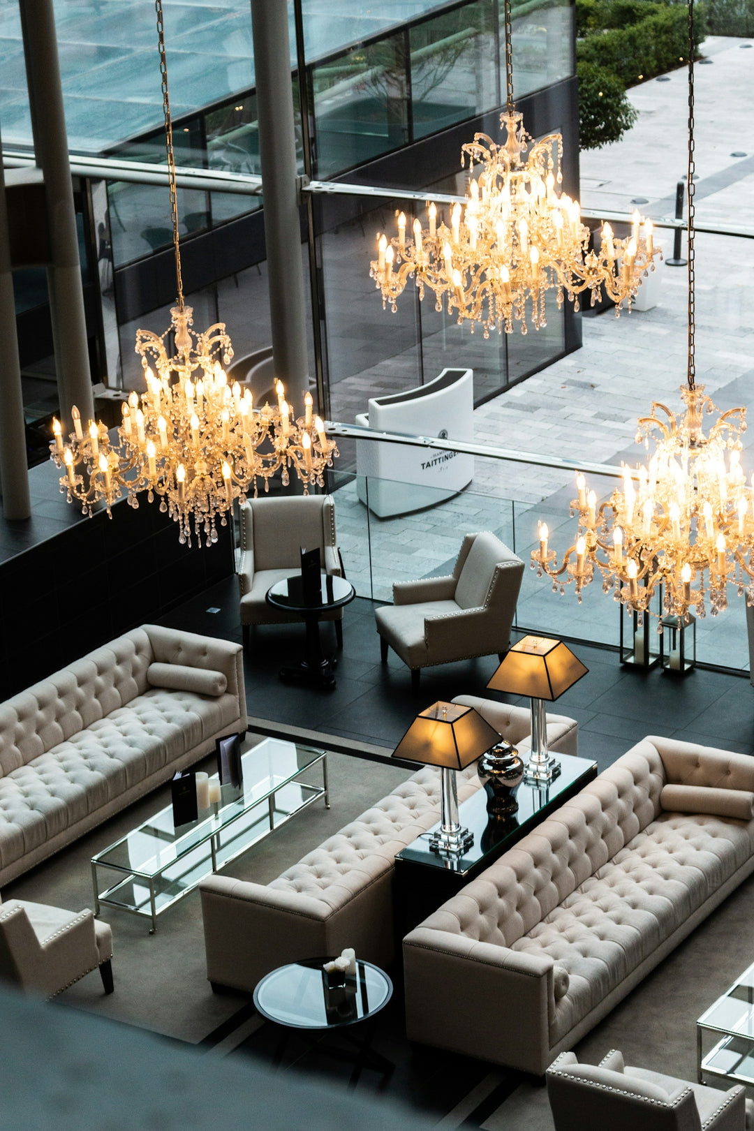 a living room filled with furniture and a chandelier