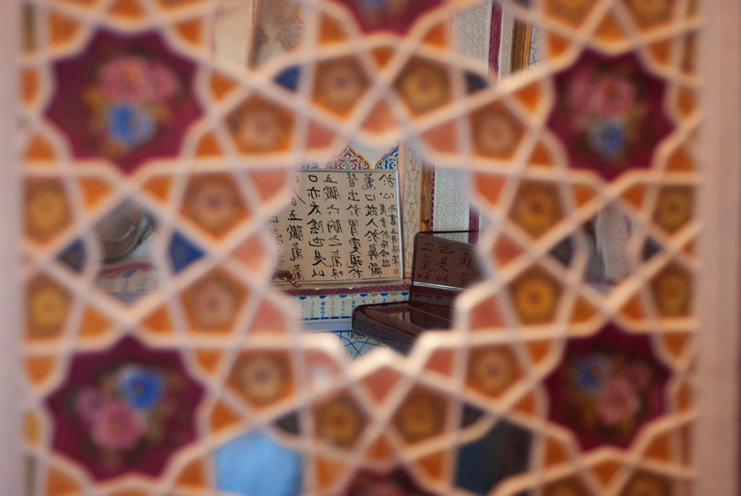 A close up of a mirror with a pattern on it