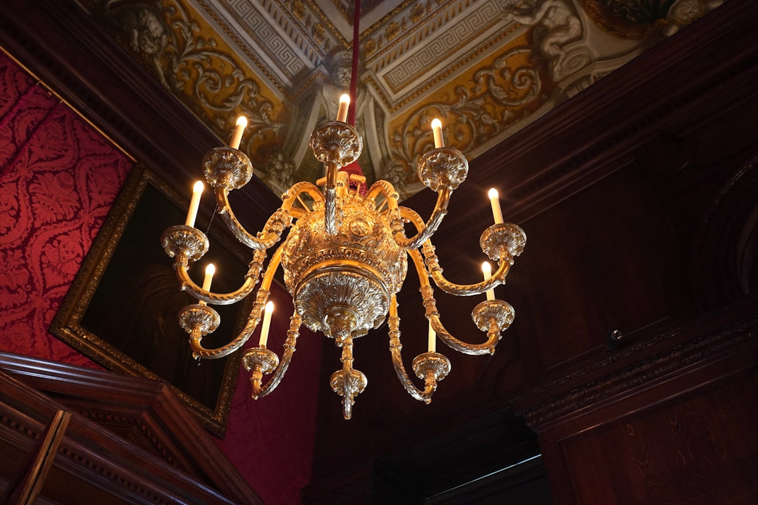A chandelier hanging from a ceiling in a room