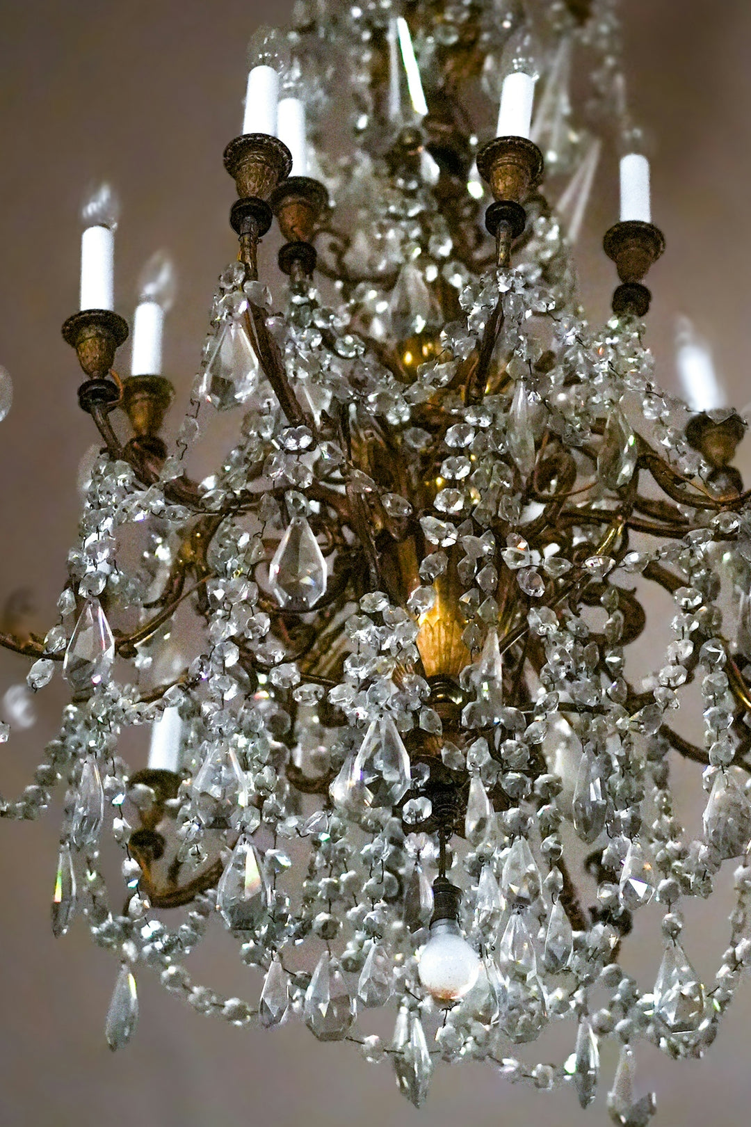 A luxurious, crystal chandelier shines beautifully.