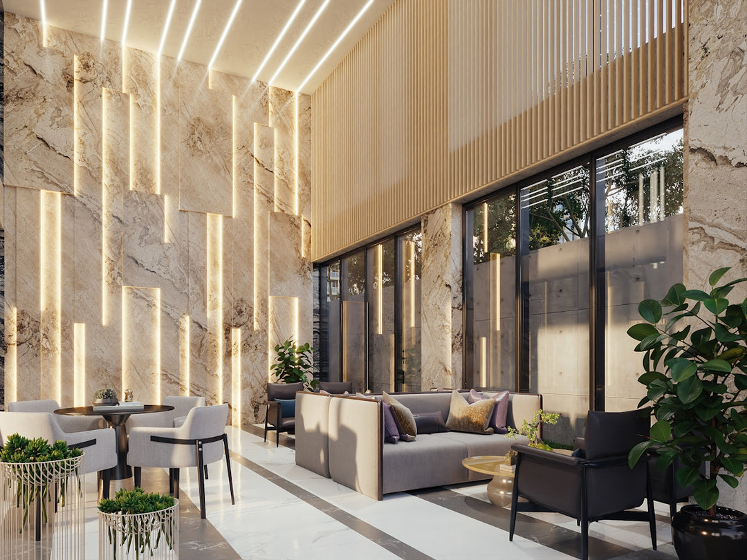 Modern lounge area with marble walls and ambient lighting.