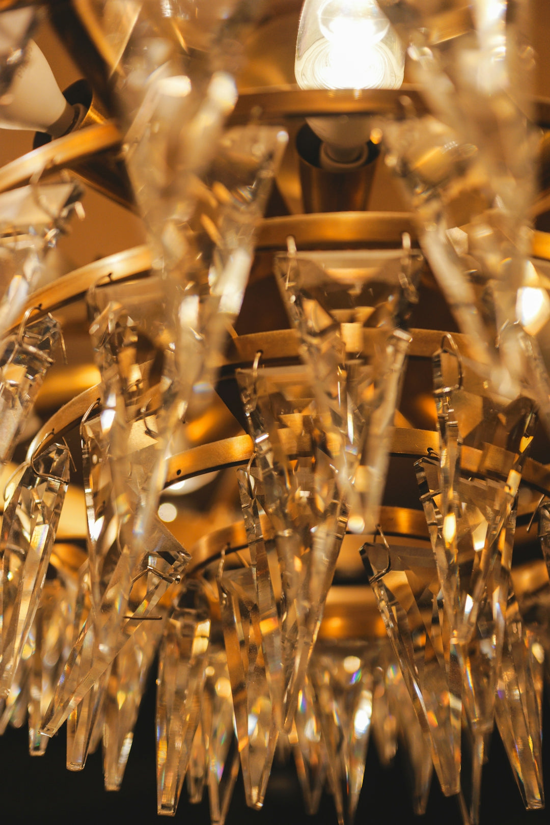 Close-up of a golden chandelier with crystal accents