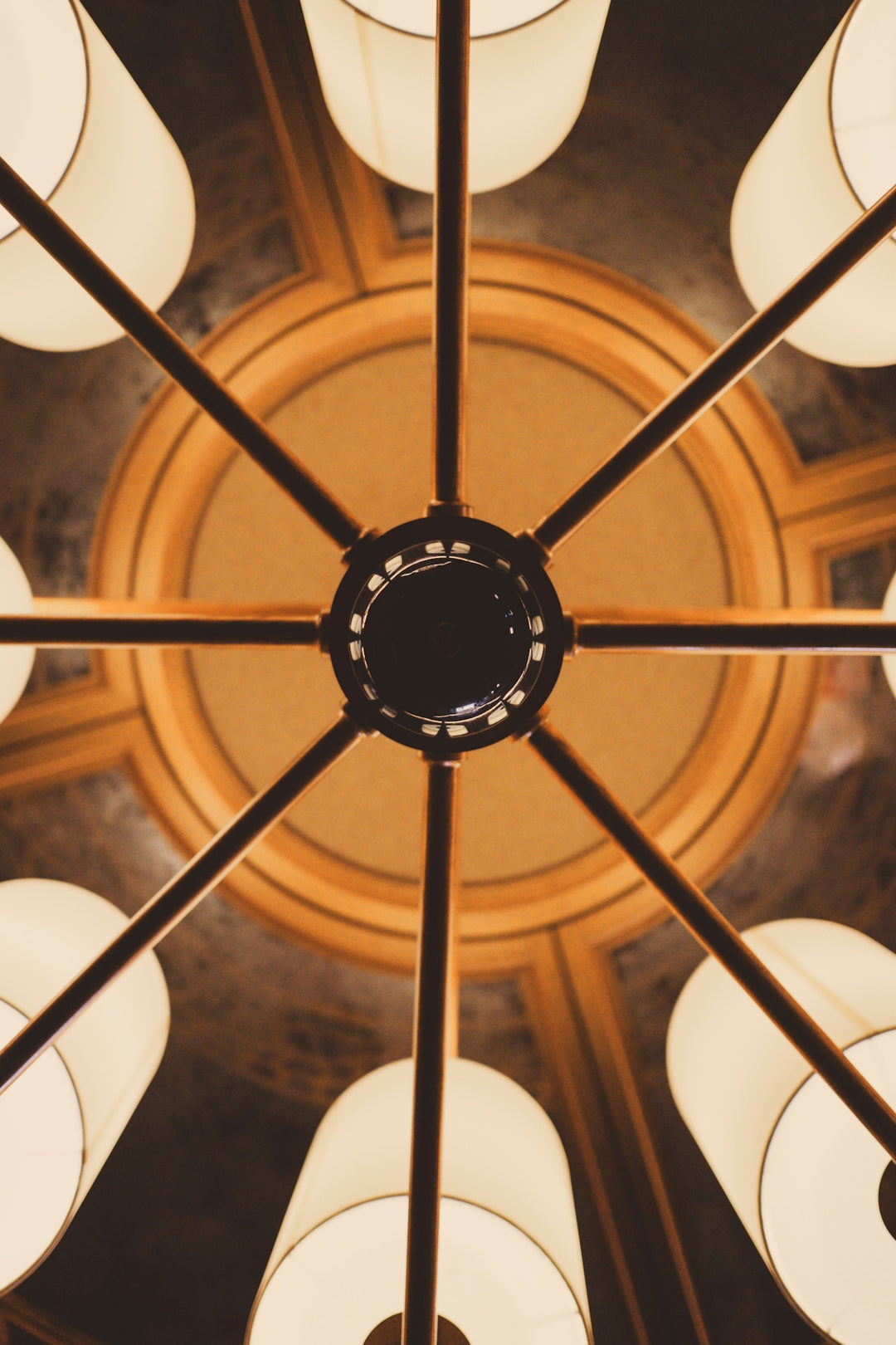 Close-up view of a vintage chandelier from below.
