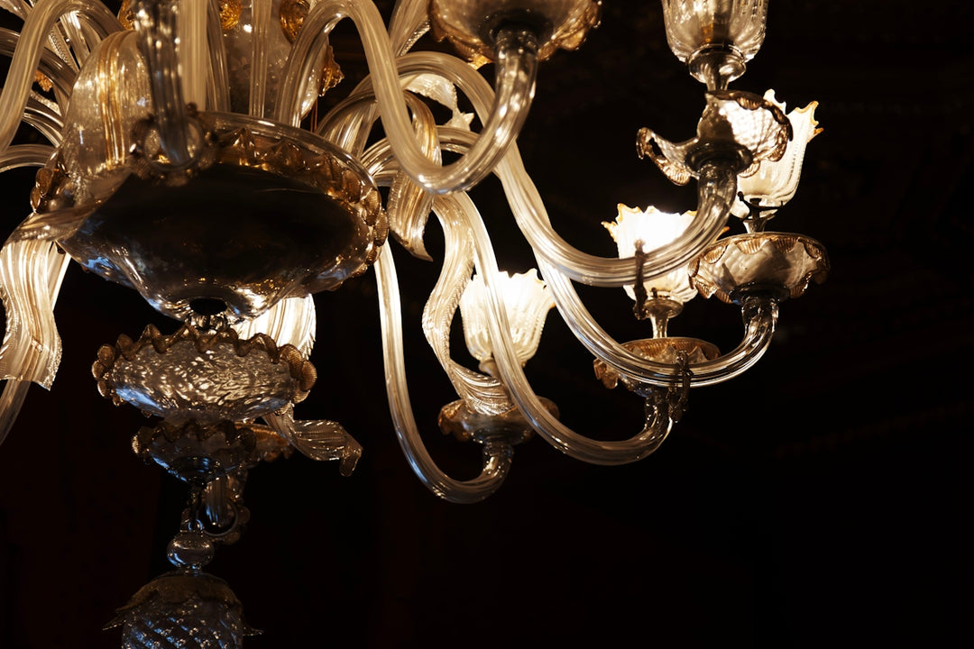 Ornate glass chandelier with warm lights