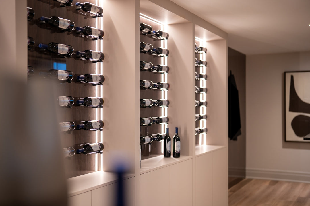 Modern wine cellar with illuminated shelves and bottles