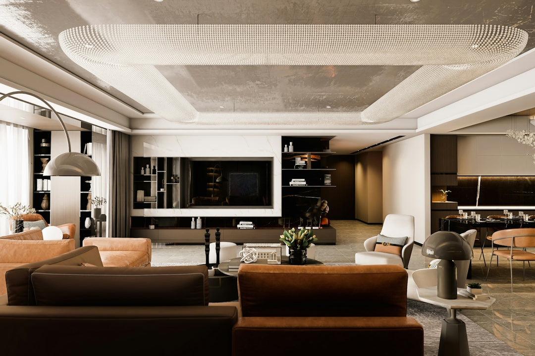 Spacious modern living room with stylish sofas and large television.